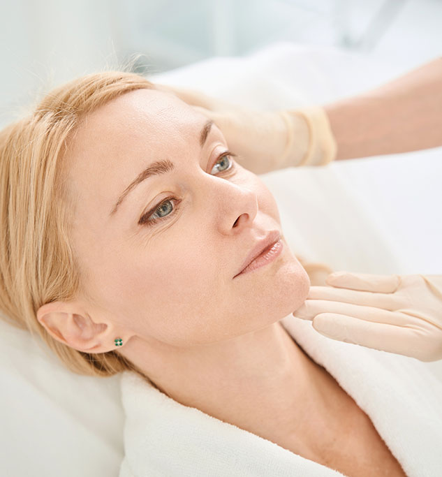 Female Relaxing During Her Post Microneedling Follow Up Visit