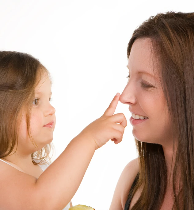 Young Child Touching Her Mom's New Nose